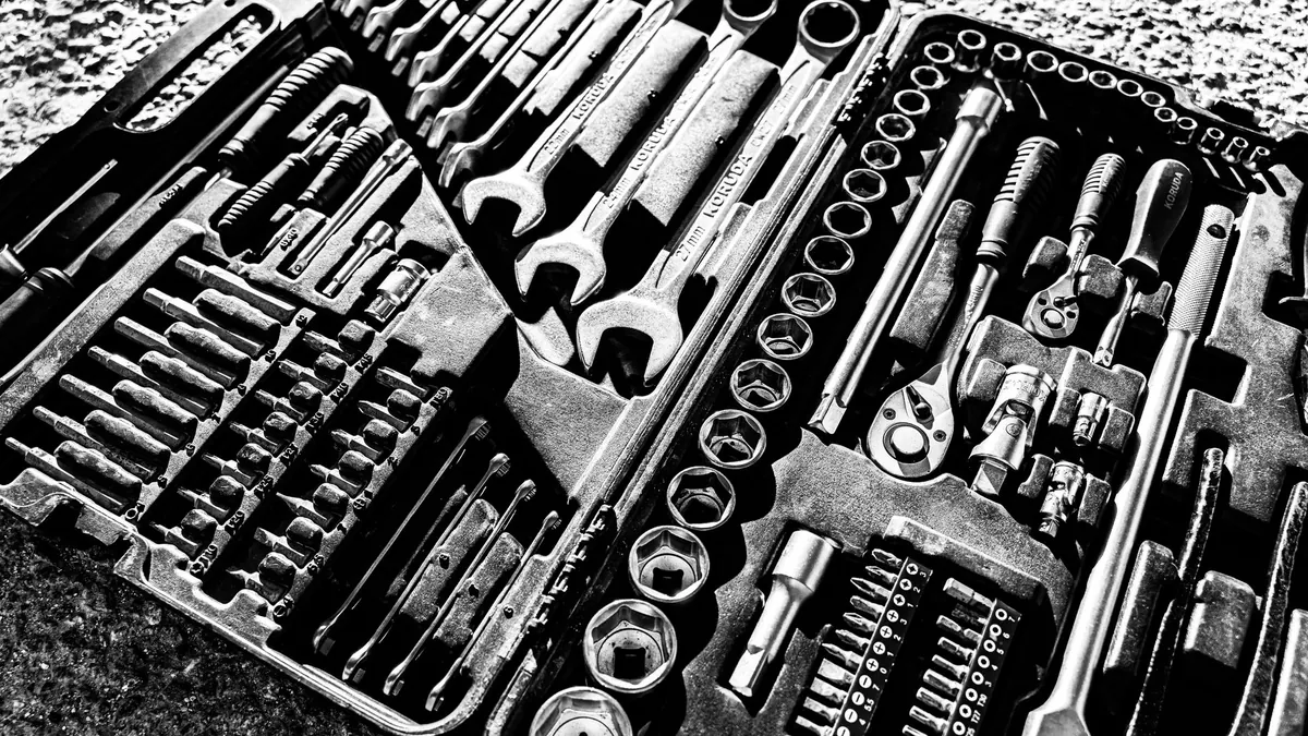 Basic tool kit with adjustable wrench, socket set, and screwdriver assortment