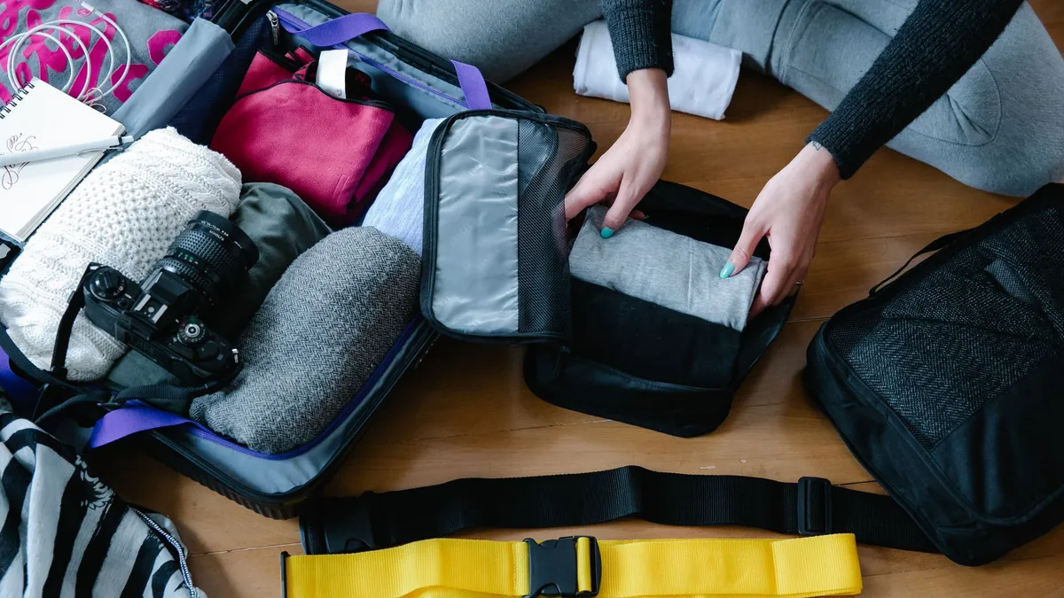 Compression packing cubes for organized luggage compartments