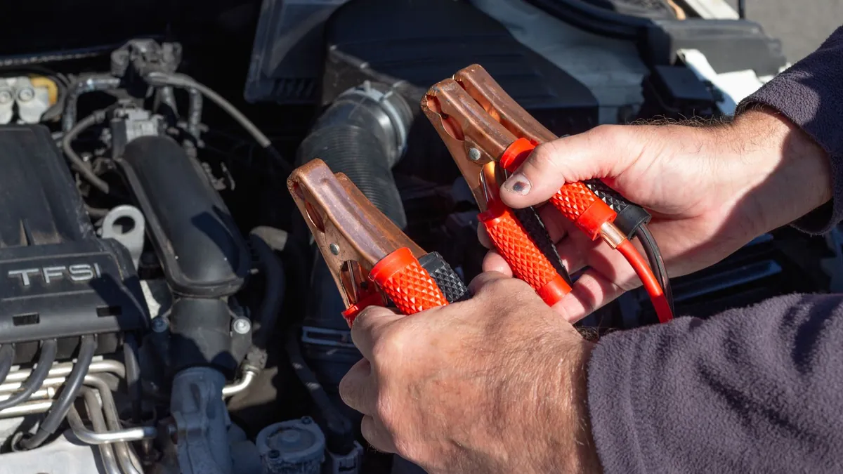 Jumper cables and portable battery jump starter for dead battery situations