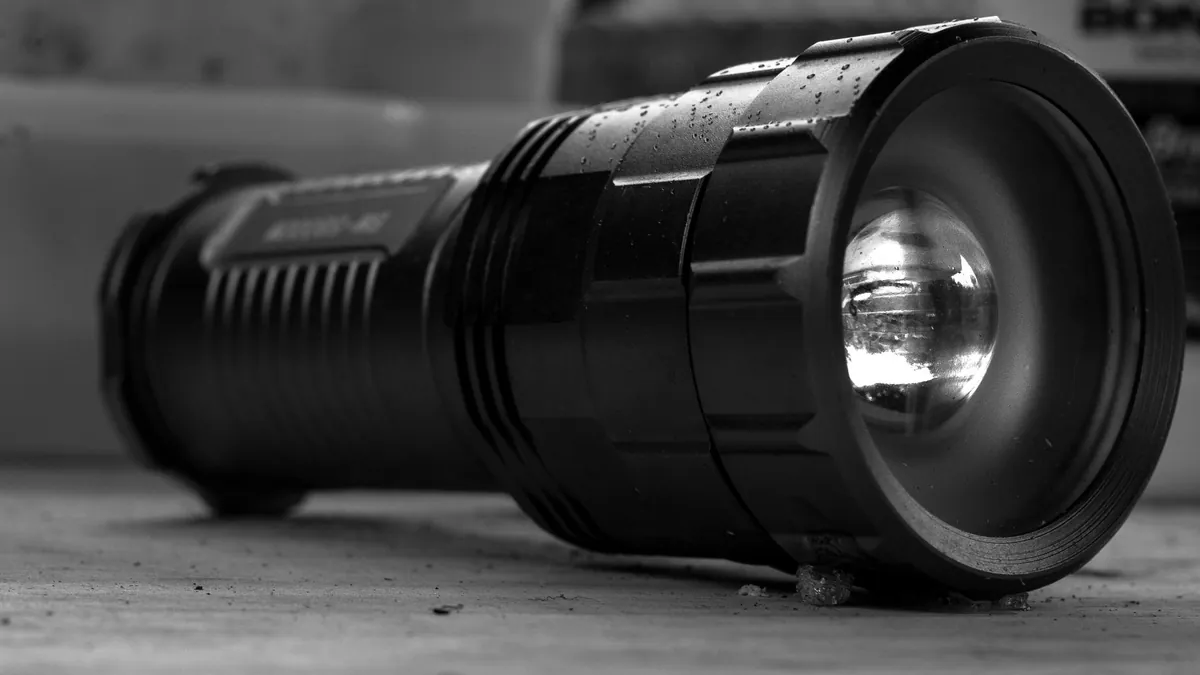 LED flashlight with extra batteries for visibility during breakdowns