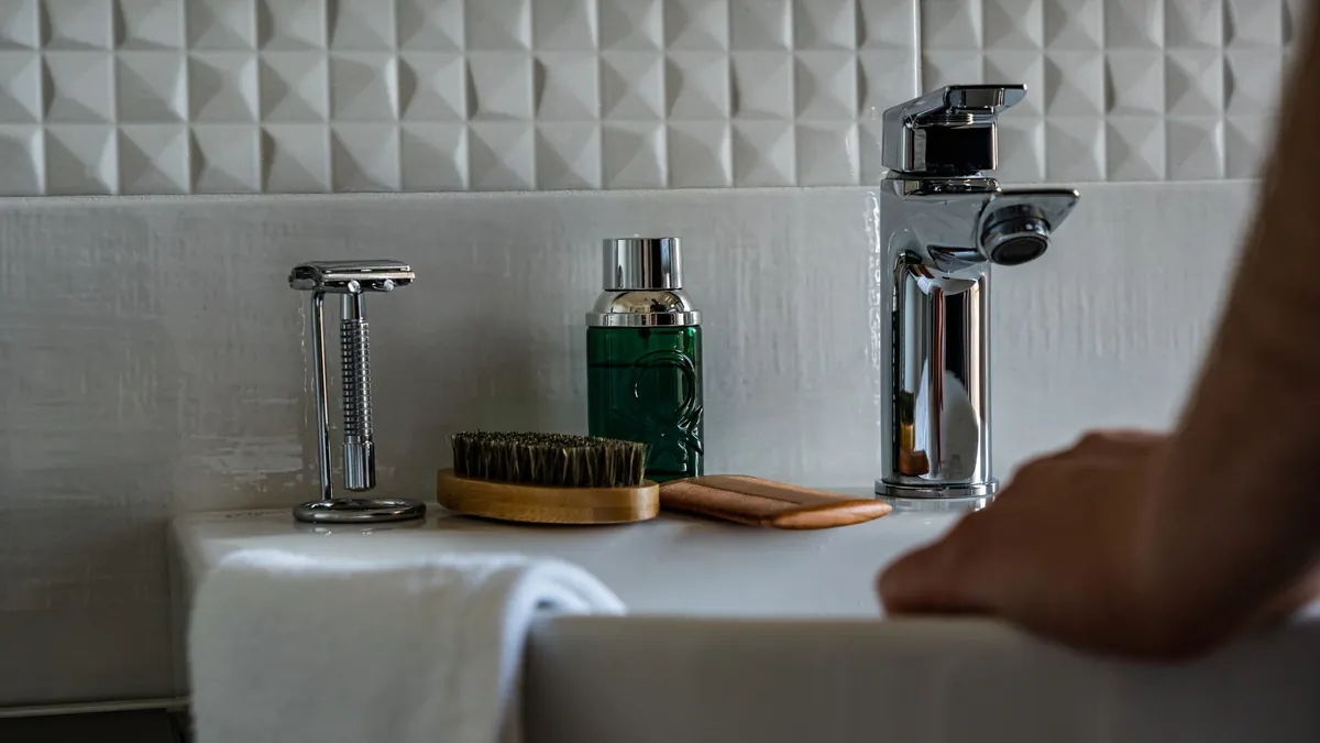 Prepare a bathroom kit with a portable seat reducer, hand sanitizer, and disposable seat covers for hygienic restroom visits